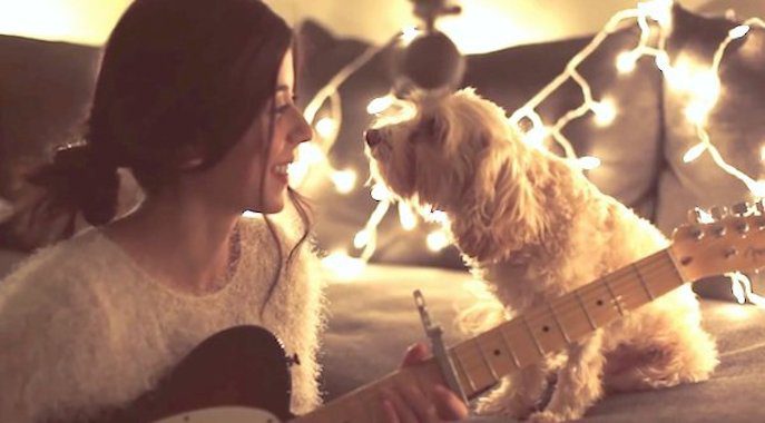 woman serenades her dog