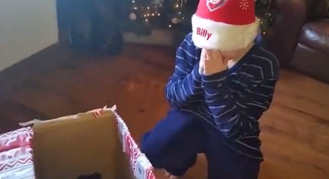 boy cries with joy when gets puppy as gift